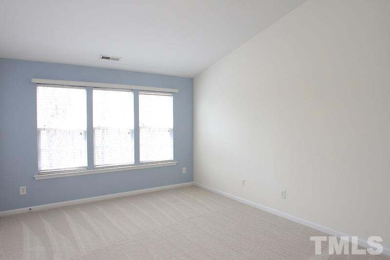 8419 Reedy Ridge Lane Raleigh, NC 27613 - Photo 8 of 20 an empty room with a window