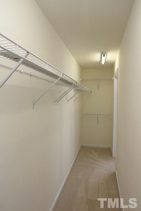 8419 Reedy Ridge Lane Raleigh, NC 27613 - Photo 9 of 20 a view of a room with racks on the wall