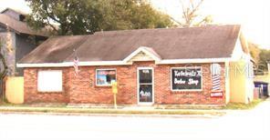 414 West Oak Ridge Road Orlando, FL 32809 - Photo 2 of 3 a view of outdoor space yard and front view of a house