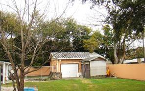 414 West Oak Ridge Road Orlando, FL 32809 - Photo 3 of 3 a front view of house with yard and trees