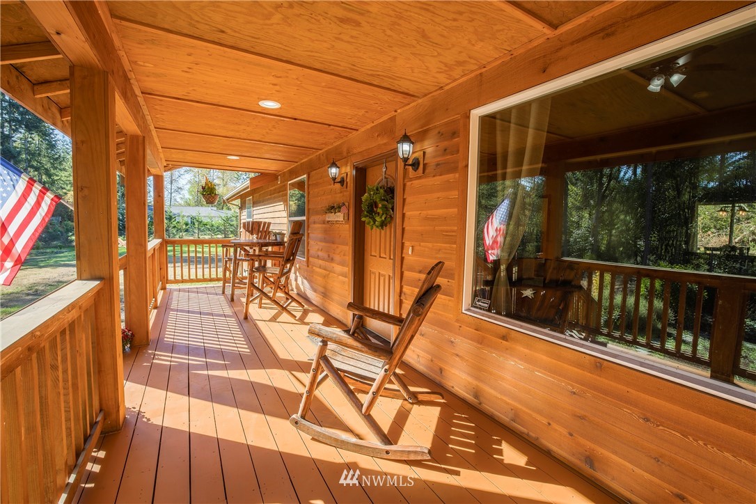 204 Webb Road Southwest Lakebay, WA 98349 - Photo 5 of 31 a view of a balcony with wooden floor