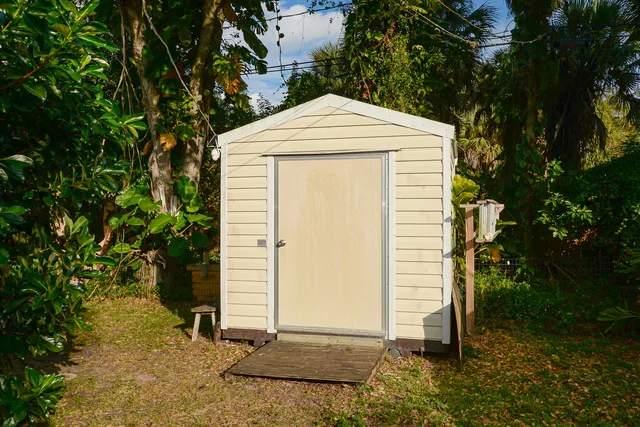a view of a house with a small yard