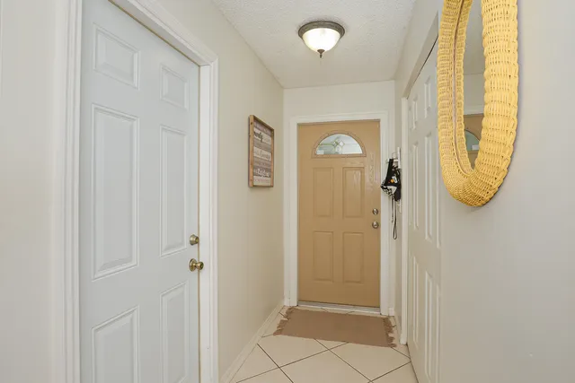 a view of a hallway with a door