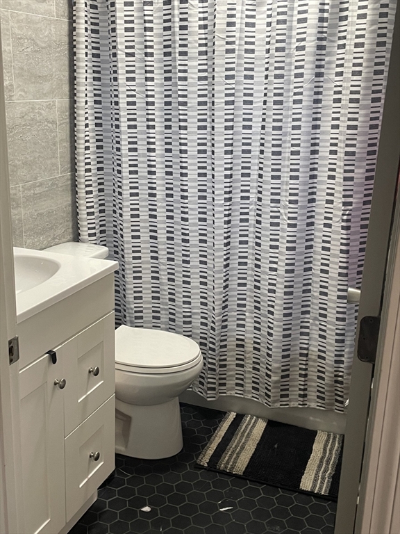 26 Sylvan Street Worcester, MA 01603 - Photo 15 of 28 a bathroom with a toilet and a sink