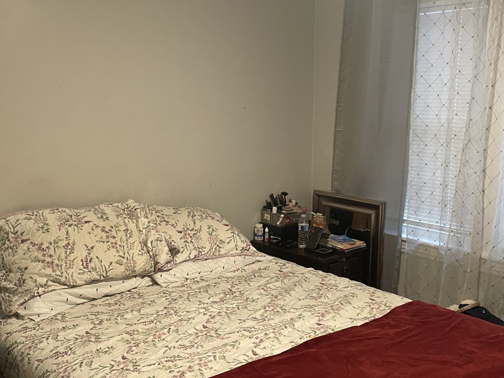 26 Sylvan Street Worcester, MA 01603 - Photo 18 of 28 a bedroom with a bed and dresser