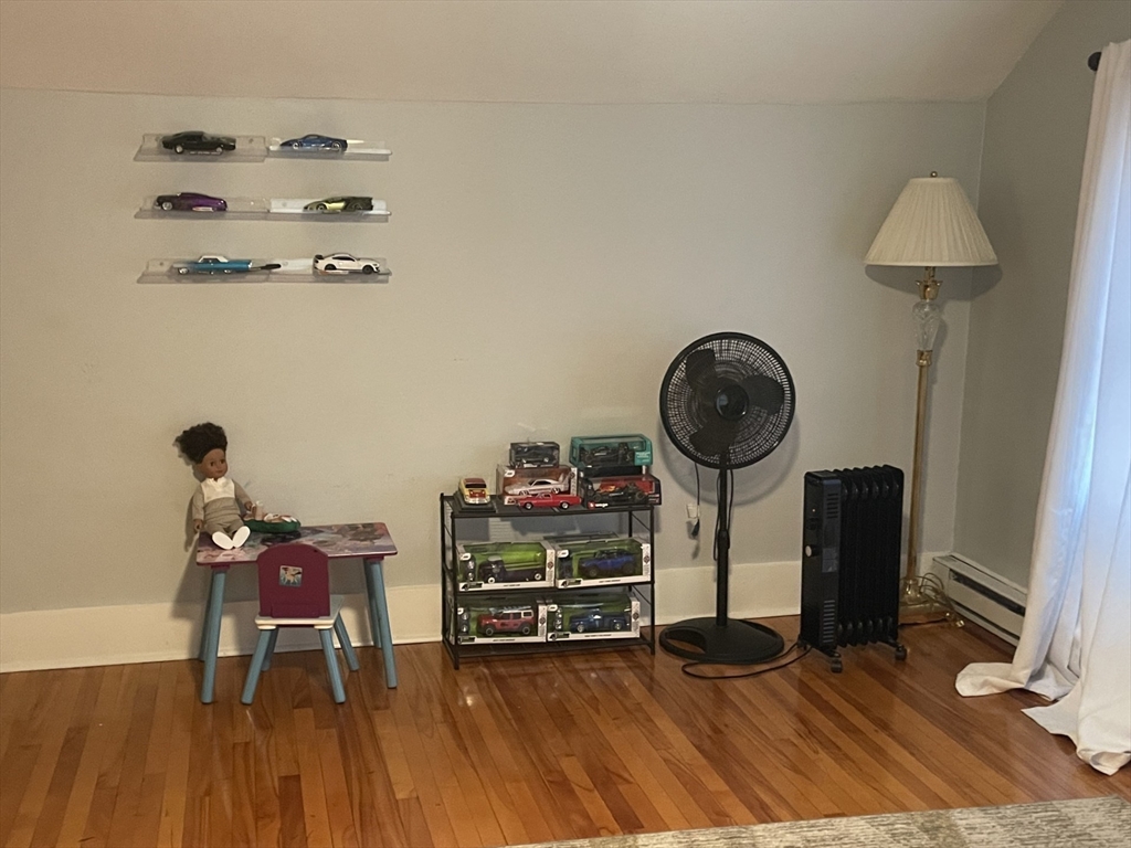 26 Sylvan Street Worcester, MA 01603 - Photo 20 of 28 a view of a workspace with furniture and wooden floor