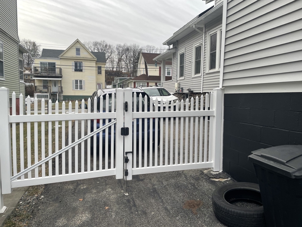 26 Sylvan Street Worcester, MA 01603 - Photo 27 of 28 a front view of a house with wooden fence