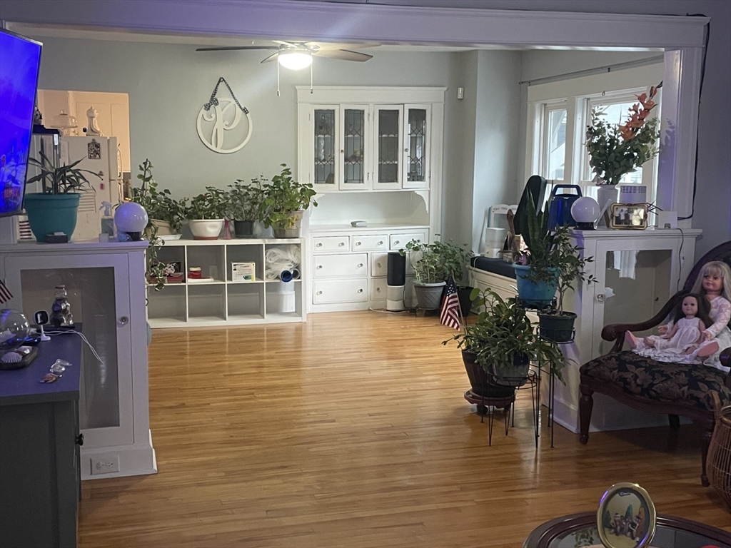 26 Sylvan Street Worcester, MA 01603 - Photo 4 of 28 a room with lots of wooden furniture and a large window