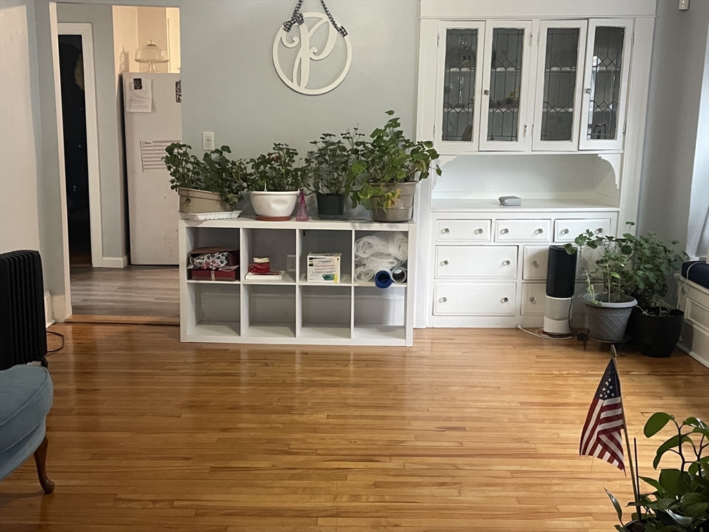 26 Sylvan Street Worcester, MA 01603 - Photo 5 of 28 a view of a dining room with furniture and a potted plant