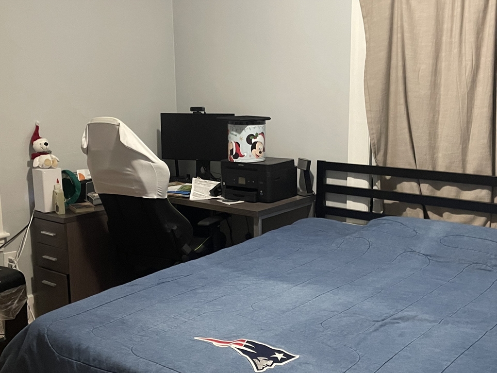26 Sylvan Street Worcester, MA 01603 - Photo 8 of 28 a bedroom with a bed and furniture