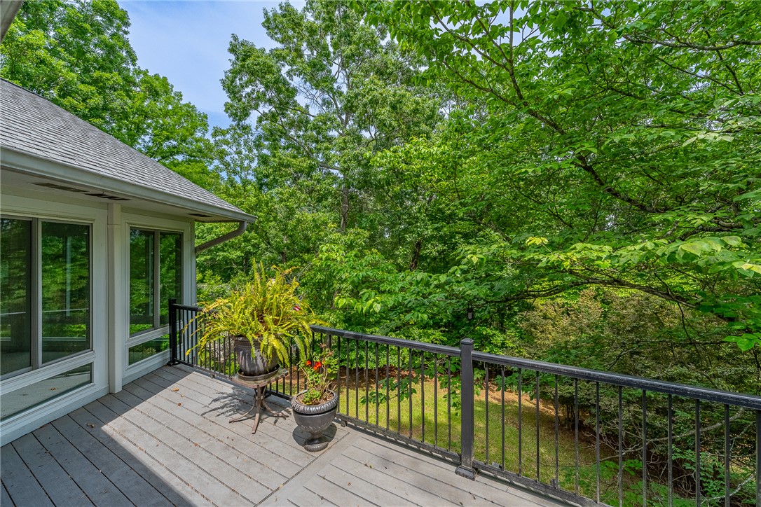 118 Beacon Ridge Circle Salem, SC 29676 - Photo 30 of 45 A spacious deck overlooks verdant trees, offering a tranquil outdoor retreat.