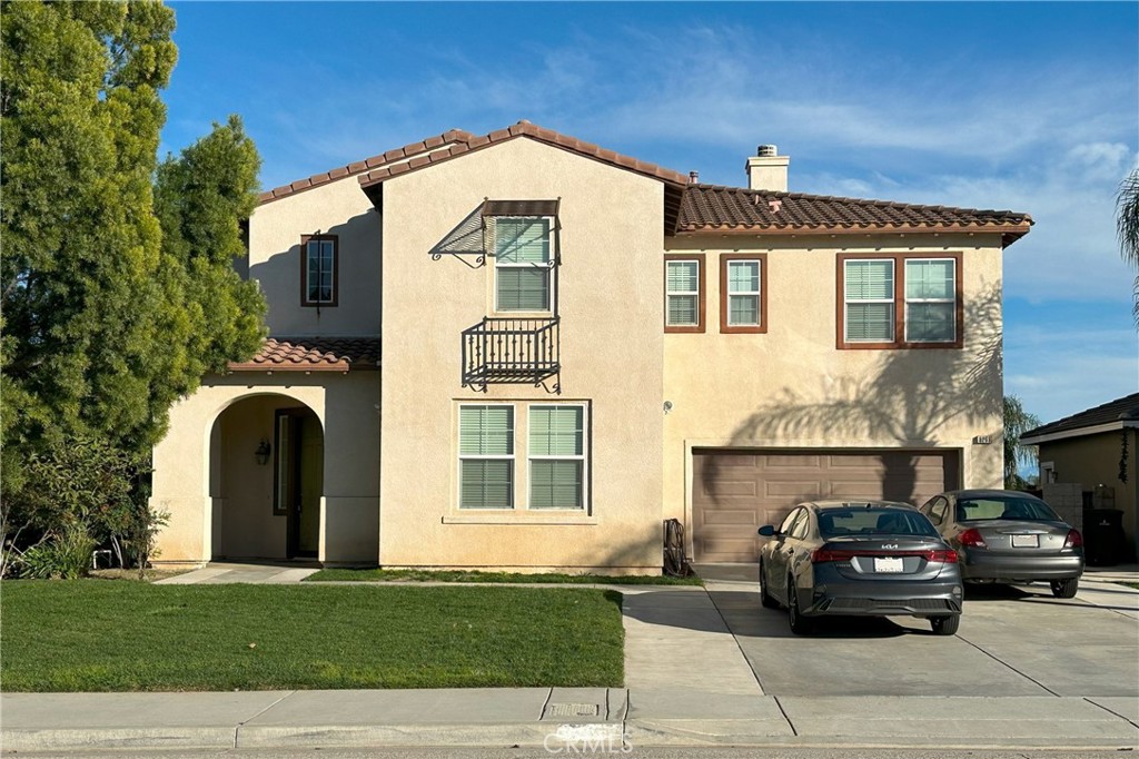 a view of a car parked in front of a house