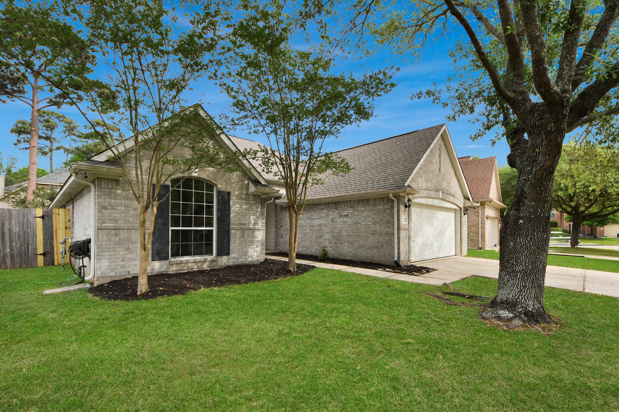 14423 Gadwall Court Houston, TX 77044 - Photo 7 of 42 a front view of house with yard and green space