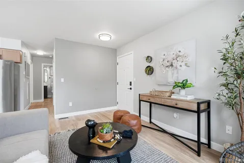a kitchen with a refrigerator and windows