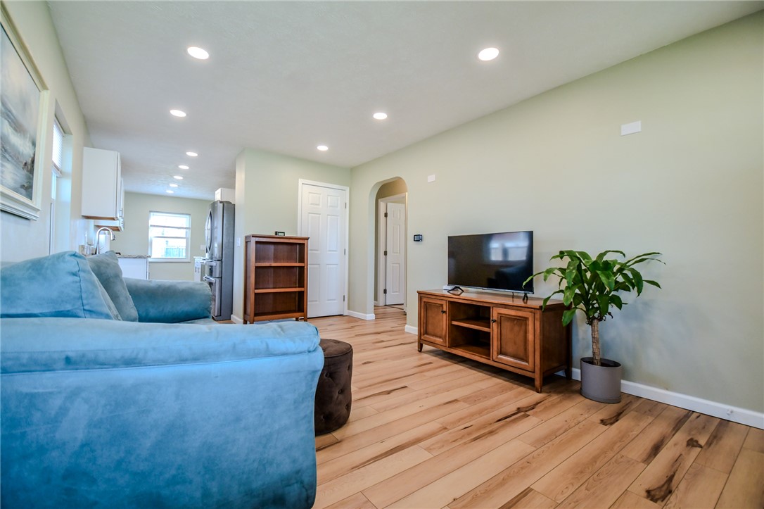 816 South Smithville Road Dayton, OH 45403 - Photo 8 of 33 This inviting living area boasts bright wood flooring, recessed lighting, and a seamless flow into the adjacent kitchen.