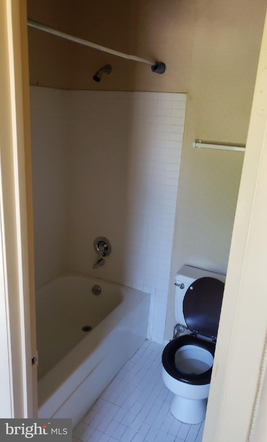 11 Hamill Road, Unit 11D Baltimore, MD 21210 - Photo 11 of 16 a bathroom with a shower and a toilet
