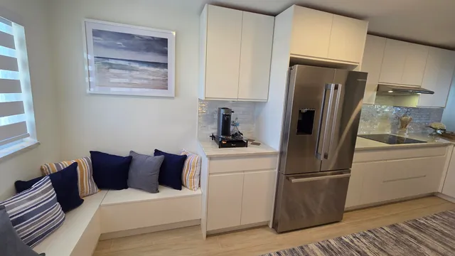 a kitchen with a refrigerator a stove and a refrigerator