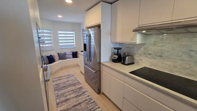 a kitchen with a sink and cabinets