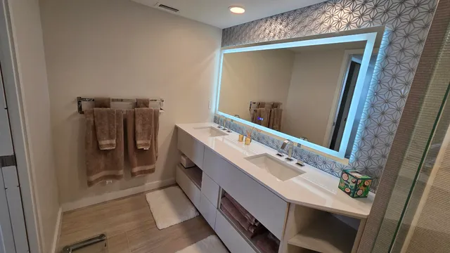 a bathroom with a sink vanity and a mirror