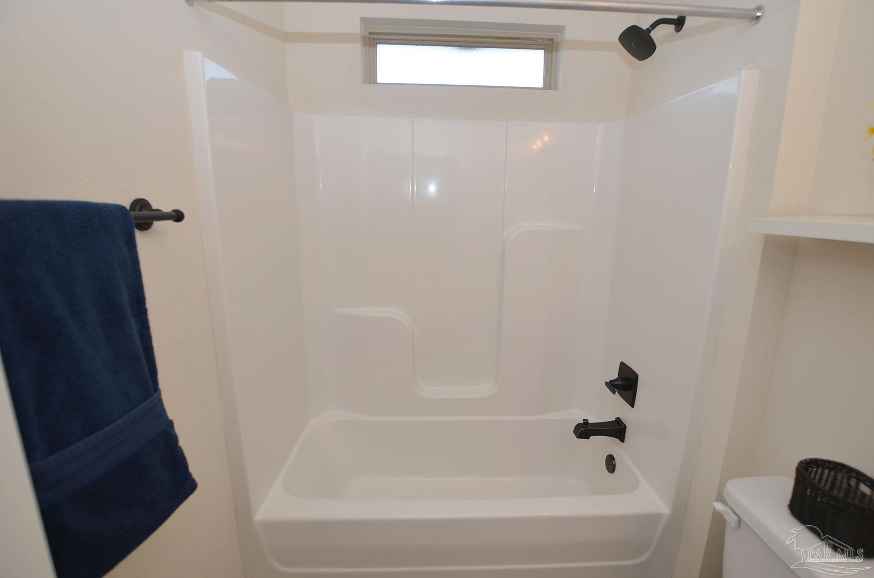 5709 Mill Stream Way Pace, FL 32571 - Photo 35 of 48 a bathroom with a bathtub