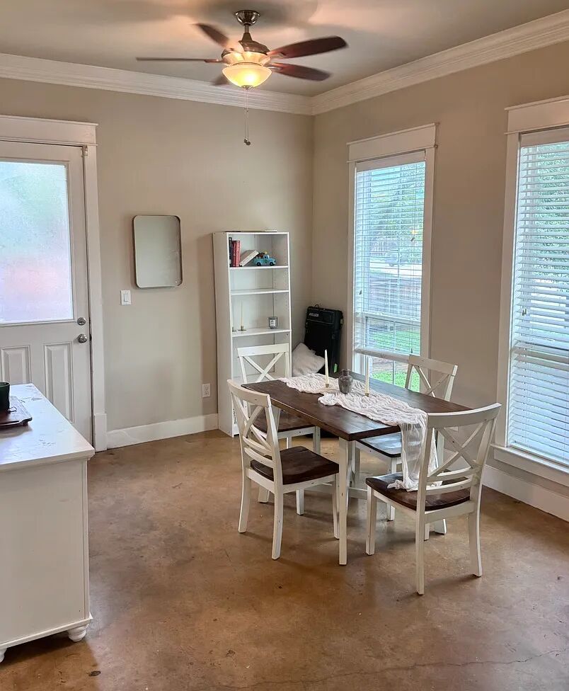 4420 Red River Street, Unit B Austin, TX 78751 - Photo 5 of 11 Functional dining area with crown molding and direct access to an exterior entry.