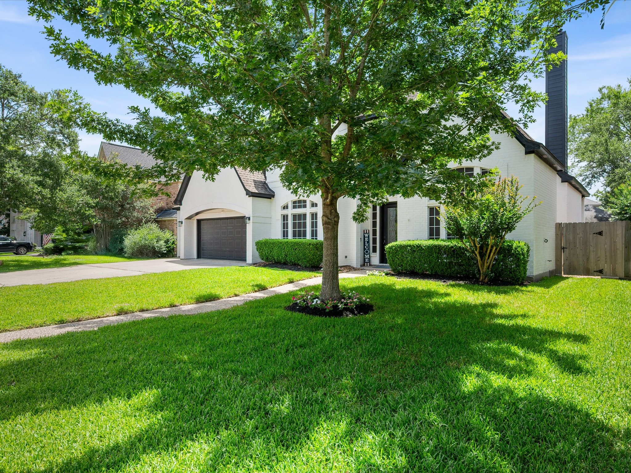 5910 Center Ct Drive Spring, TX 77379 - Photo 5 of 50 Mature trees and lush landscaping create a picturesque setting, adding beauty, privacy, and a sense of established character to the property.