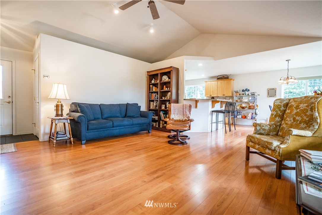 18806 Sams Place Southwest Rochester, WA 98579 - Photo 11 of 40 a living room with furniture and wooden floor