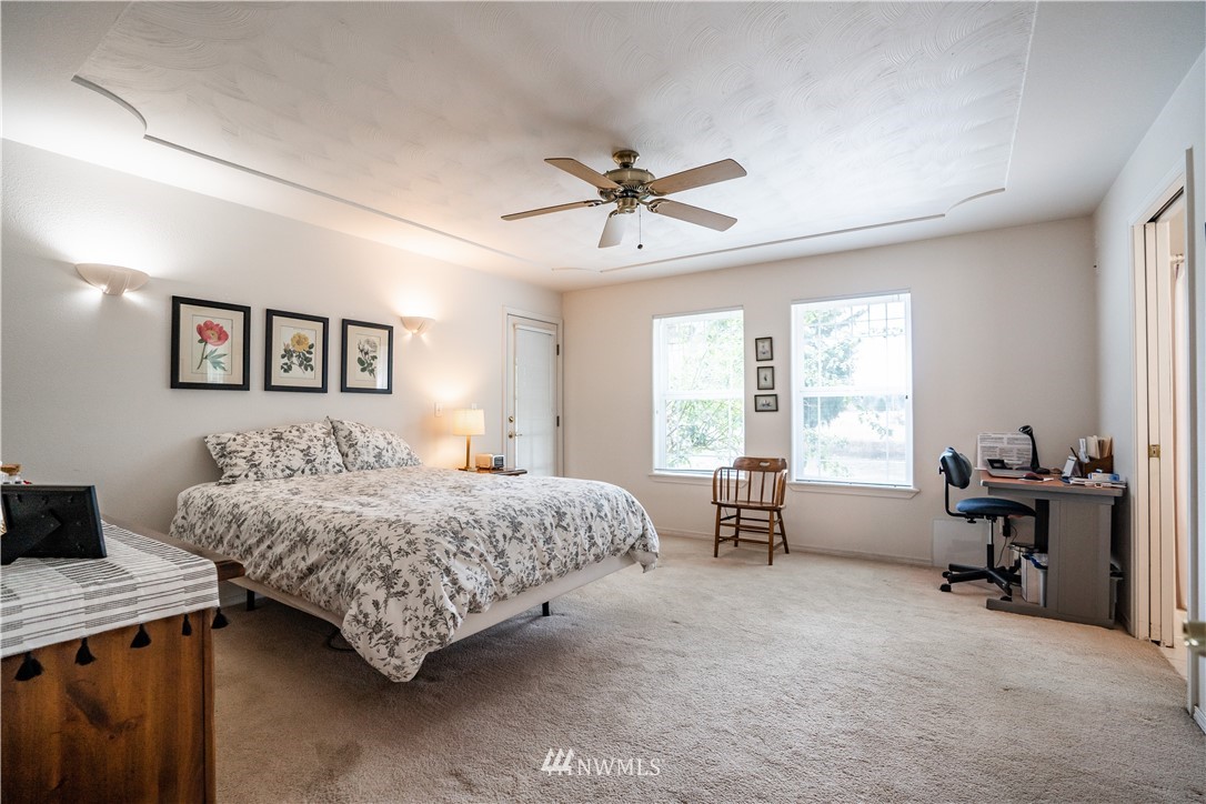 18806 Sams Place Southwest Rochester, WA 98579 - Photo 28 of 40 a bedroom with a bed and a couch