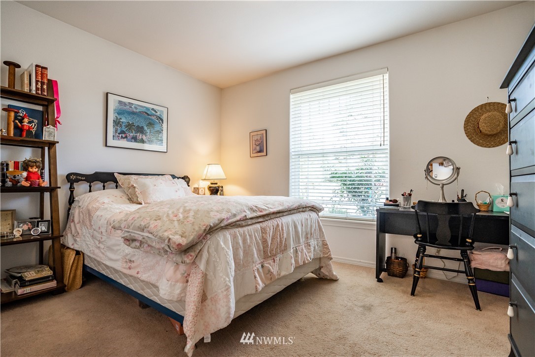 18806 Sams Place Southwest Rochester, WA 98579 - Photo 33 of 40 a bed room with a bed and a window