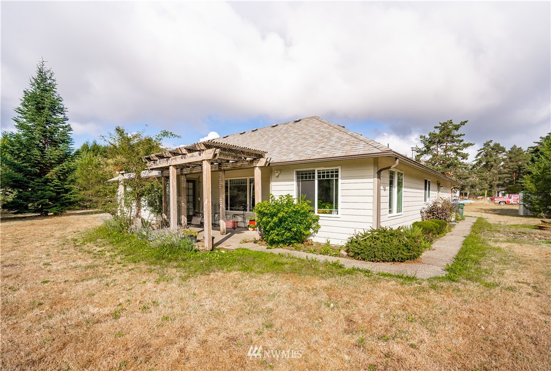 18806 Sams Place Southwest Rochester, WA 98579 - Photo 37 of 40 a front view of a house with garden