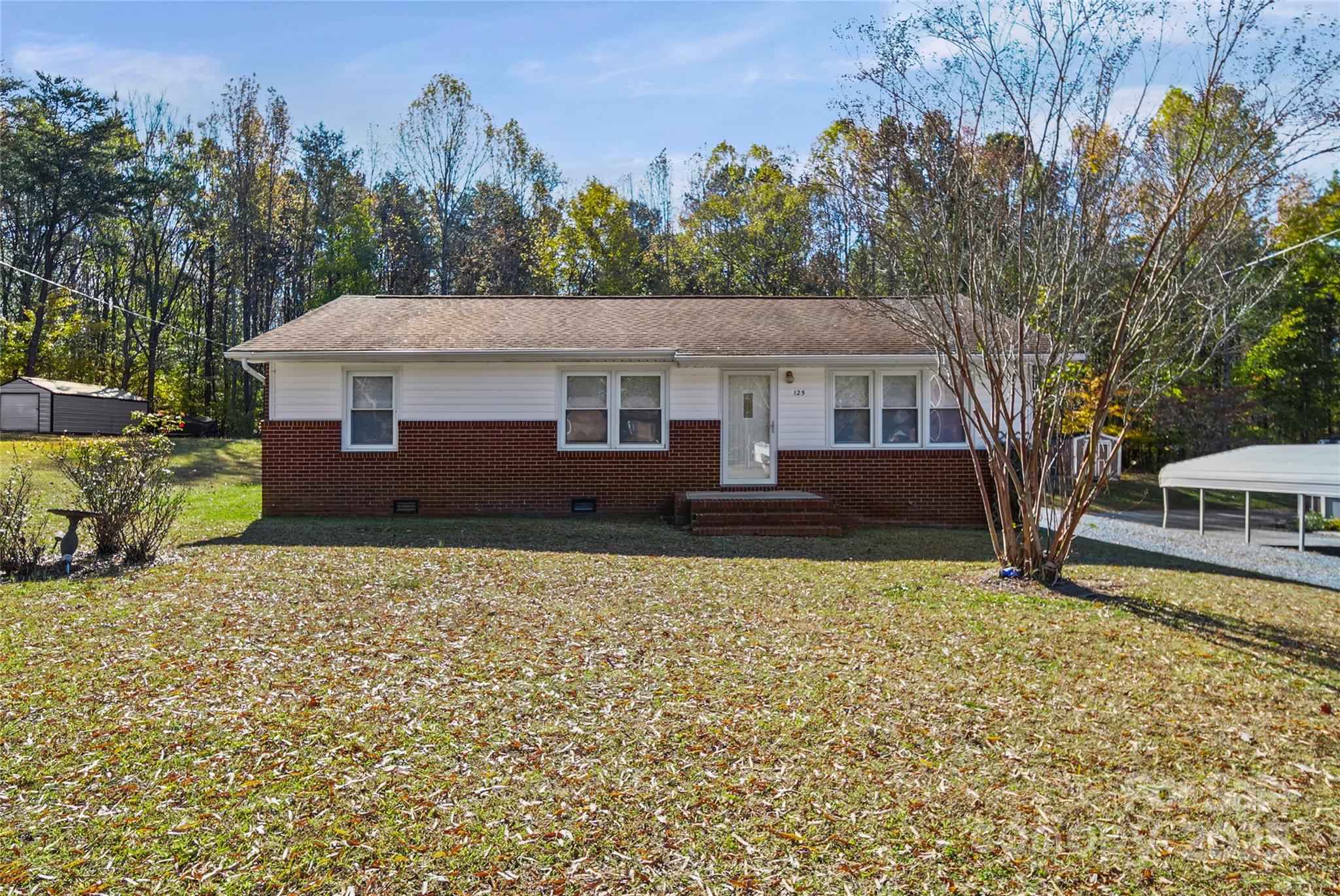 125 Lowder Road Albemarle, NC 28001 - Photo 1 of 37 a front view of a house with a yard