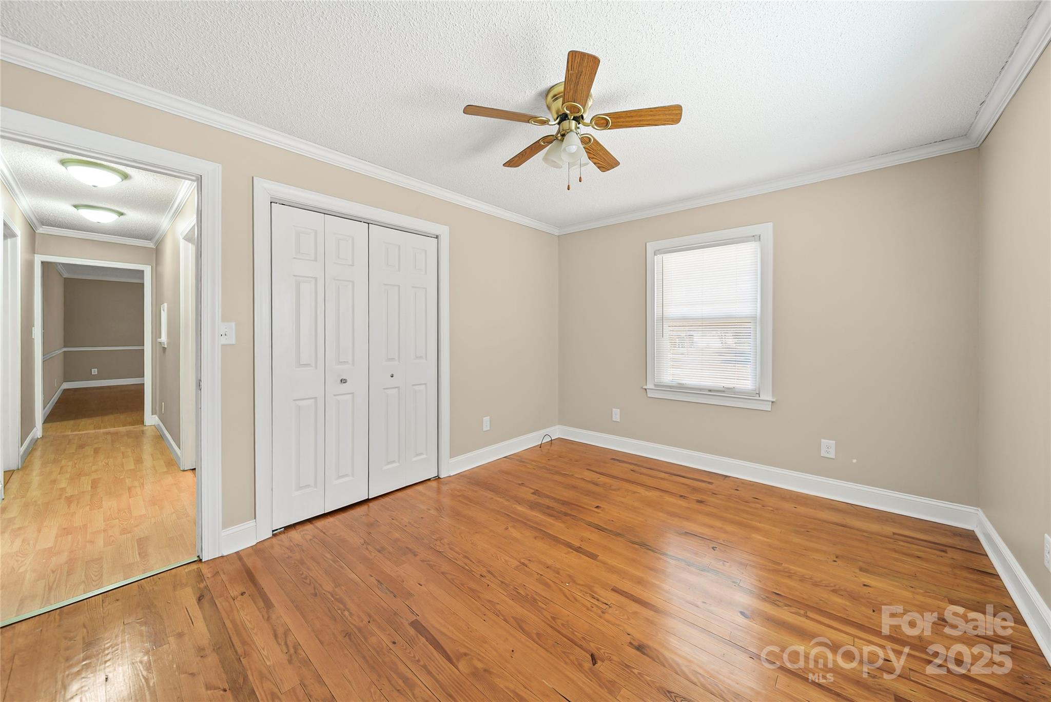 125 Lowder Road Albemarle, NC 28001 - Photo 20 of 37 a view of a room with wooden floor and a ceiling fan