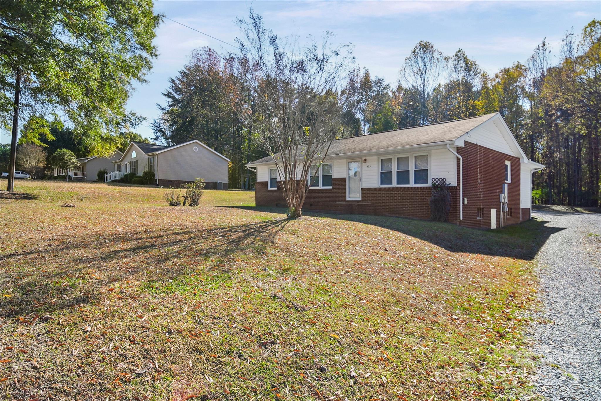 125 Lowder Road Albemarle, NC 28001 - Photo 2 of 37 a view of a house with a yard covered in snow