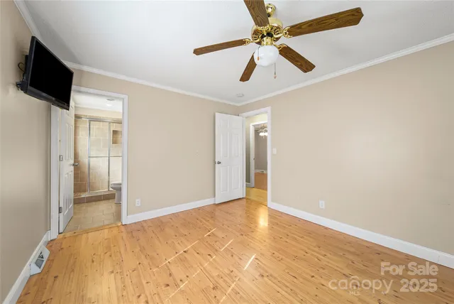 an empty room with fan and a ceiling fan