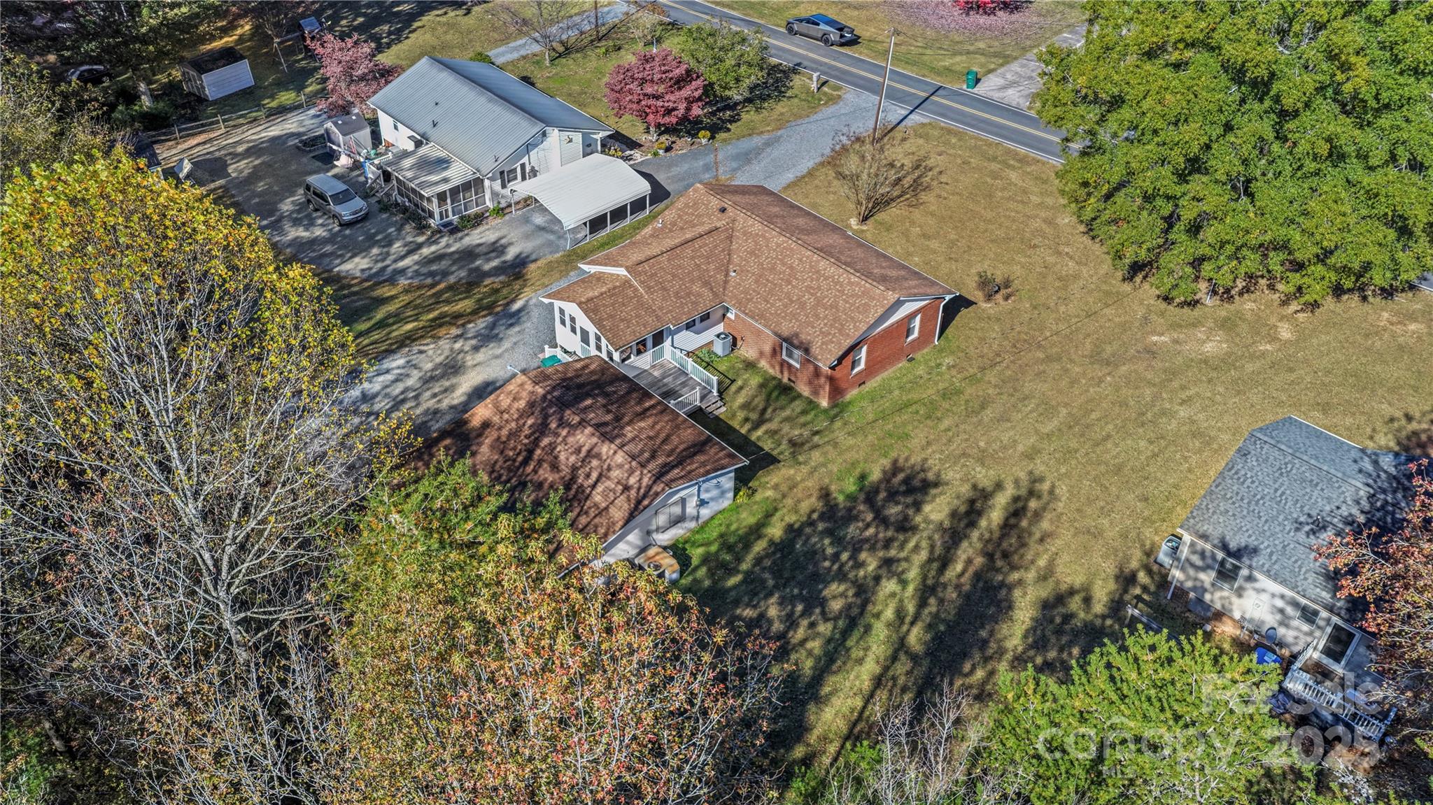 125 Lowder Road Albemarle, NC 28001 - Photo 36 of 37 an aerial view of a house with a yard and trees all around
