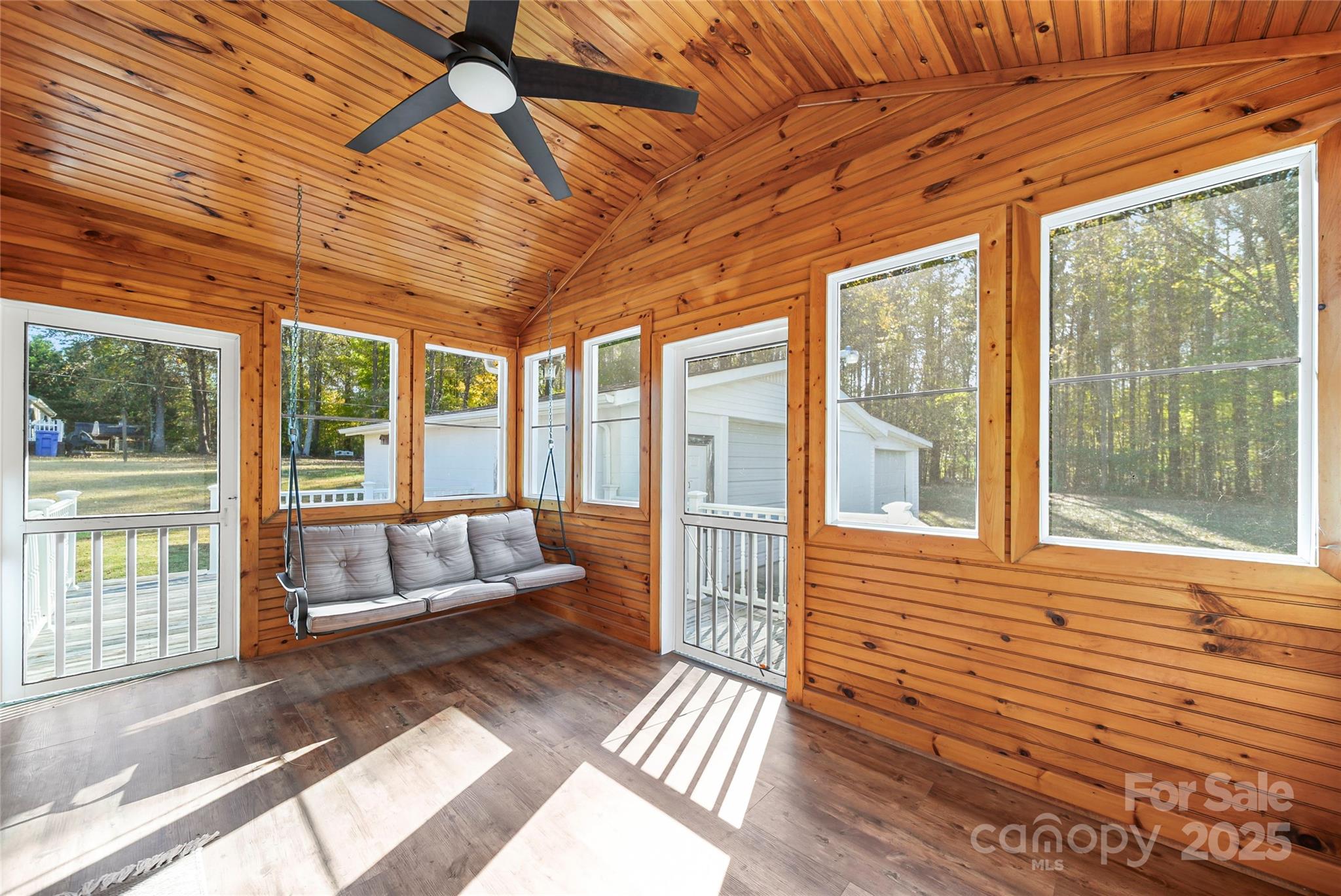 125 Lowder Road Albemarle, NC 28001 - Photo 6 of 37 a view of a porch with wooden floor and iron stairs