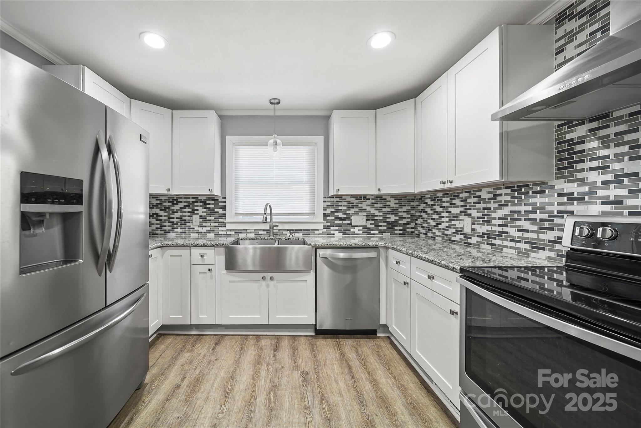 125 Lowder Road Albemarle, NC 28001 - Photo 7 of 37 a kitchen with a sink stove and refrigerator