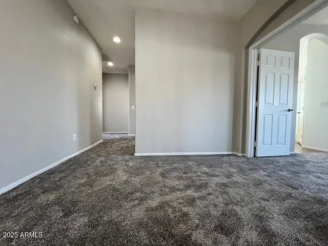 a bathroom with a double vanity sink toilet and a mirror