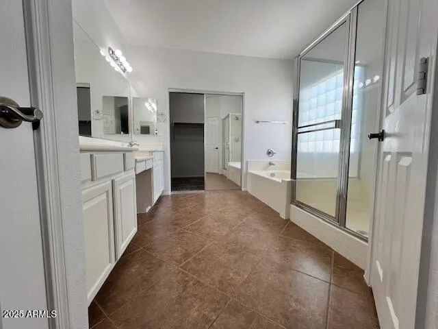 a bathroom with bathtub and shower