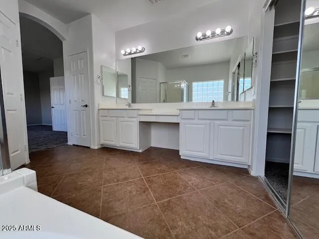 a bathroom with a toilet and a rug