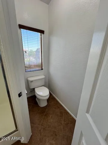 a view of a house with a yard and garage