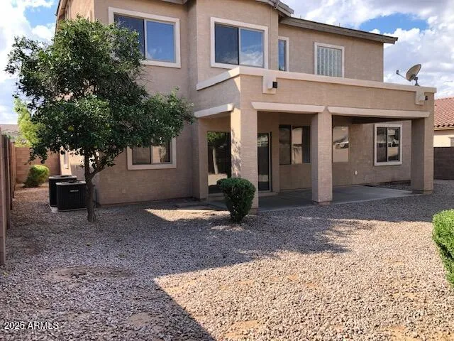 a view of a backyard of the house