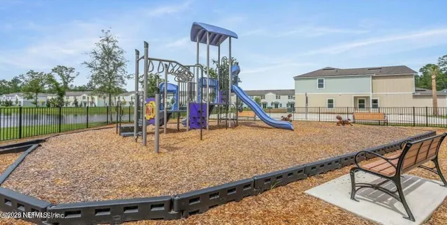 a view of a backyard with a slide