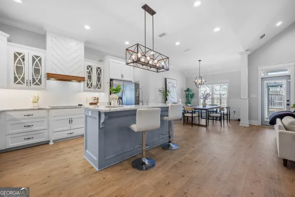 a kitchen with stove and cabinets