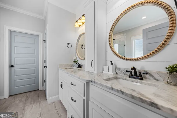a utility room with cabinets washer and dryer