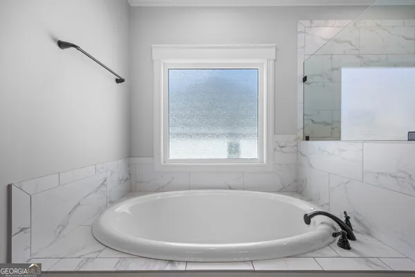 a view of storage and utility room with washer and dryer