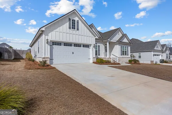 a view of a livingroom with furniture and windows