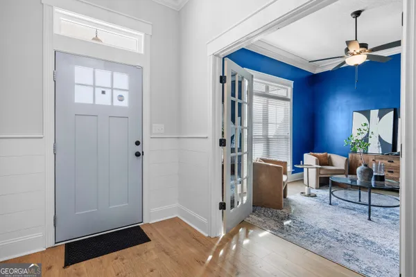 a living room with furniture and a large window