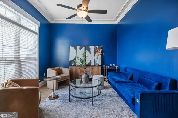 a living room with furniture and a flat screen tv