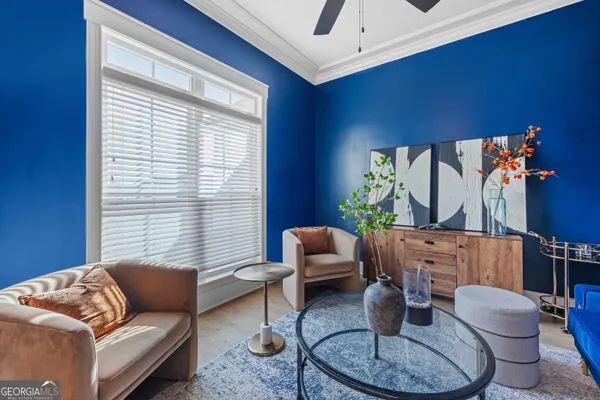 a living room with furniture and a flat screen tv